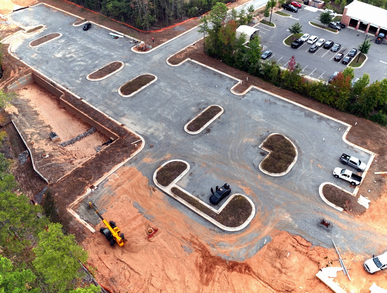 Commercial parking construction — grading and curb installation